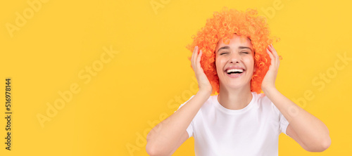 Woman isolated face portrait, banner with copy space. i am so happy. express positive emotions. cheerful lady wear wig. woman has orange hair.
