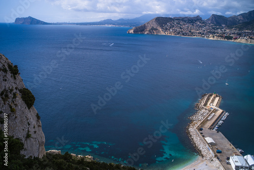 view from above of a small port in the Mediterranean Sea and hotels with mountains in the background Calpe city