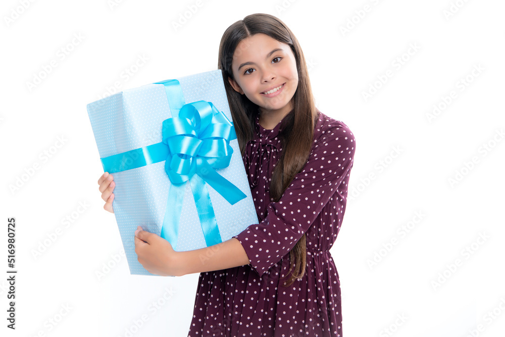 Teenager child with gift box. Present for holidays. Happy birthday, Valentines day, New Year or Christmas. Kid hold present box. Portrait of happy smiling teenage child girl. Teenager child with gift box. Present for holidays. Happy birthday, Valentines day, New Year or Christmas. Kid hold present box. Portrait of happy smiling teenage child girl.