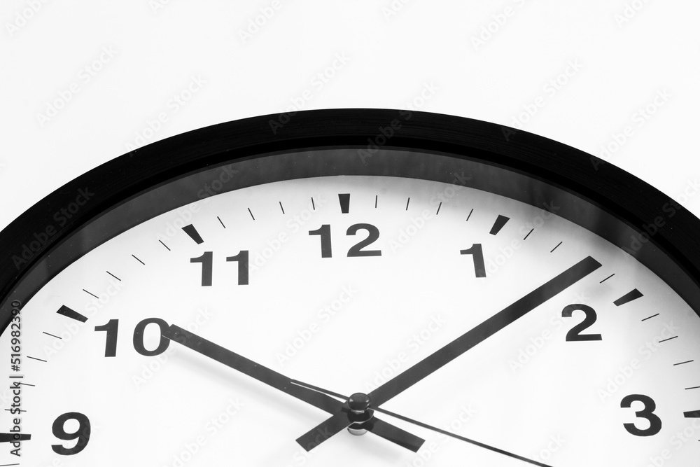 Black and white clock. Round wall clock - time to work concept Black and white clock. Round wall clock - time to work concept