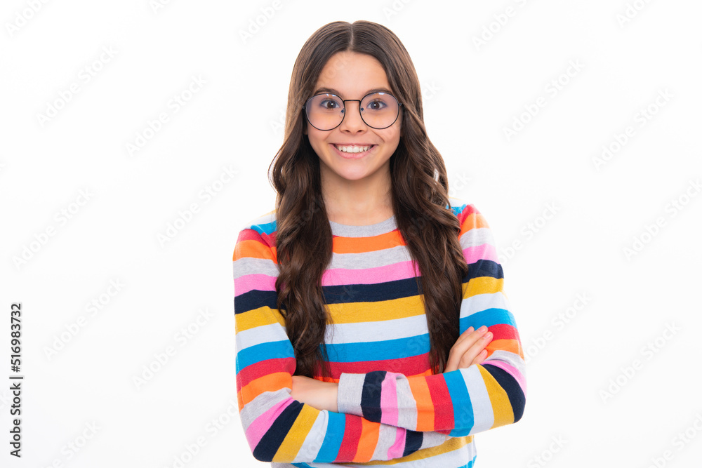 Confident child keep arms crossed, isolated on white background, empty space. Little caucasian teenage girl 12, 13, 14 years old hold hands crossed. Happy girl face, positive and smiling emotions.