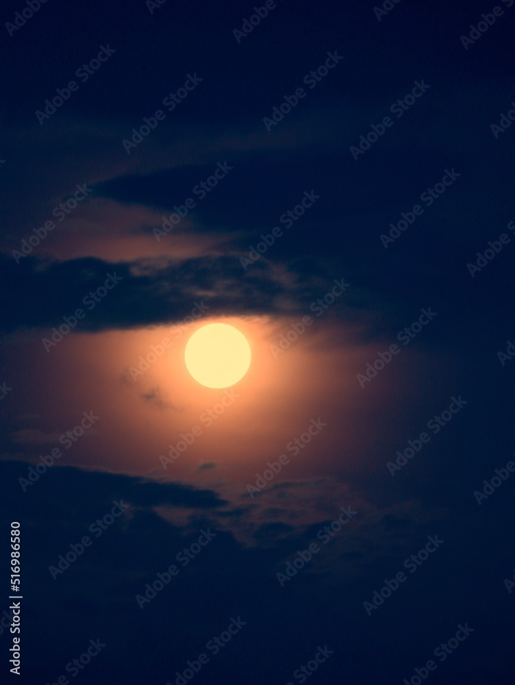 full moon surrounded by the dark cloud
