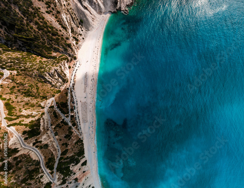 aerial top shot drone of myrtos beach, kefalonia island with emerald sea and some clouds with blue sky, panoramic photo