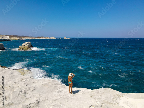 aerial shot of woman look horizon in her summer holidays in Zakynthos island, Greece