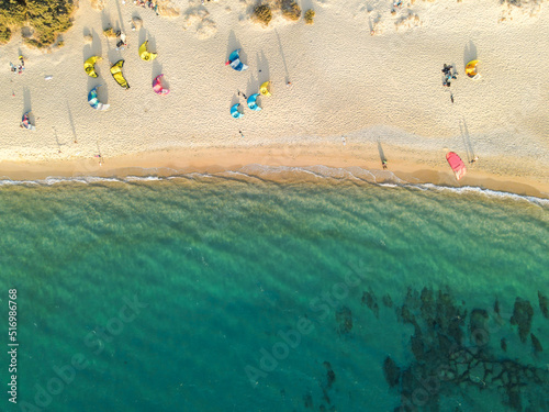 Fototapeta Naklejka Na Ścianę i Meble -  vertical drone photography of aquatics sports on beach, milos island, Greece, copy space