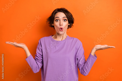 Photo of impressed funky lady wear violet sweatshirt showing arms scales empty s Fototapeta