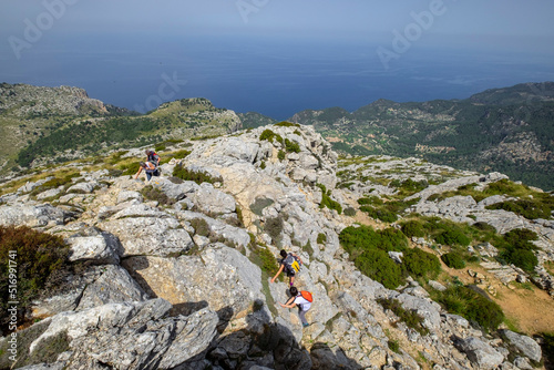 escursionistas ascendiendo al Puig de Galatzó,1.027 m, Paraje natural de la Serra de Tramuntana, Mallorca, balearic islands, Spain photo