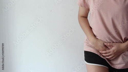 woman hands holding pressing her crotch lower abdomen, Abdominal pain of young woman, gynecological or medical problems concept,
