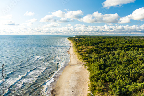 Fototapeta Naklejka Na Ścianę i Meble -  Aerial view of the Baltic Sea shore line near Klaipeda city, Lithuania. Beautiful sea coast on summer day.