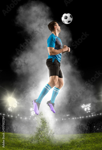 Soccer player hitting ball with head. © Andrey Burmakin
