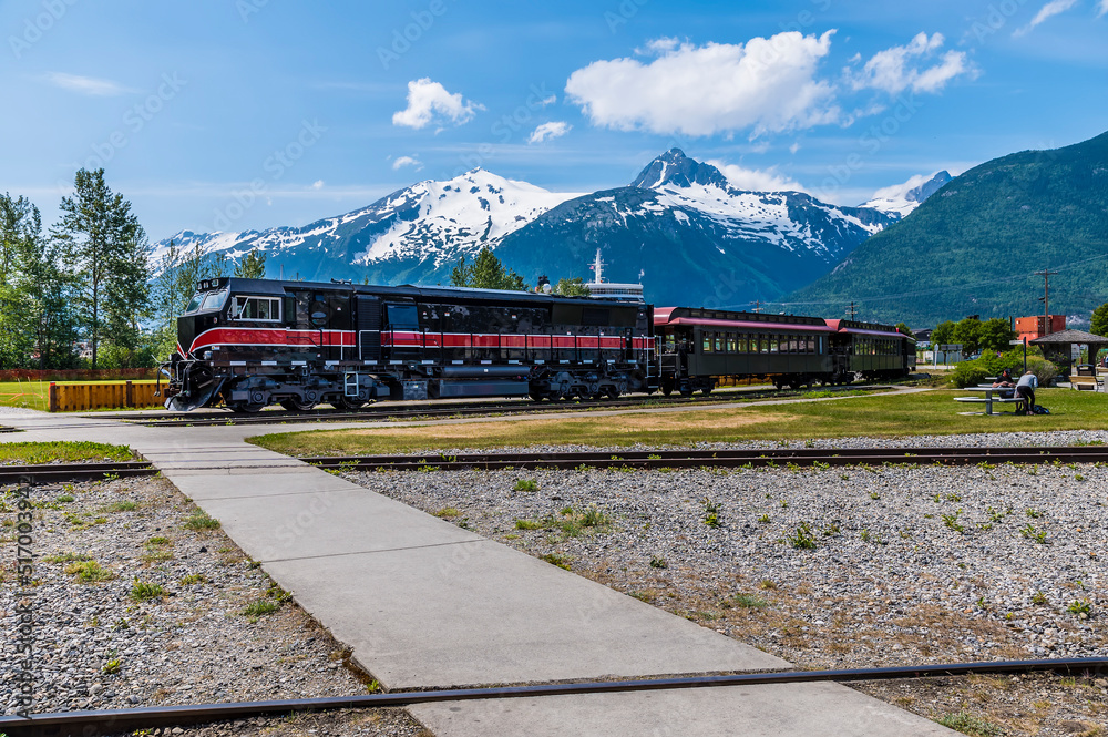 A view of a train heading out on White Pass & Yukon Route Railway at Skagway, Alaska in summertime
