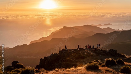 Group of tourists at the view point of Pico do Arieiro at sunset on Madeira, Portugal photo