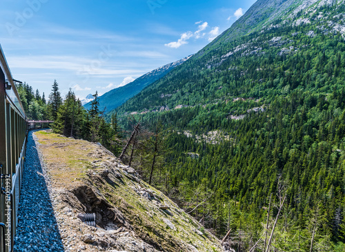 A view from a train on the White Pass and Yukon railway near Skagway, Alaska in summertime photo