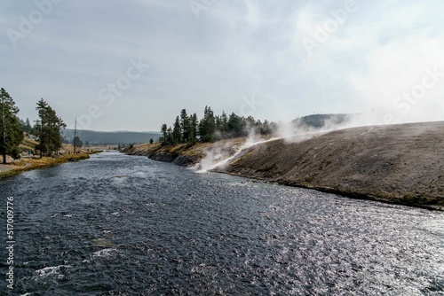 Flowing river with steam from hot springs in Yellowstone National Park