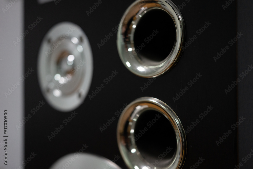 Chrome elements of music speakers close-up. Selective focus, soft focus, bokeh Chrome elements of music speakers close-up. Selective focus, soft focus, bokeh