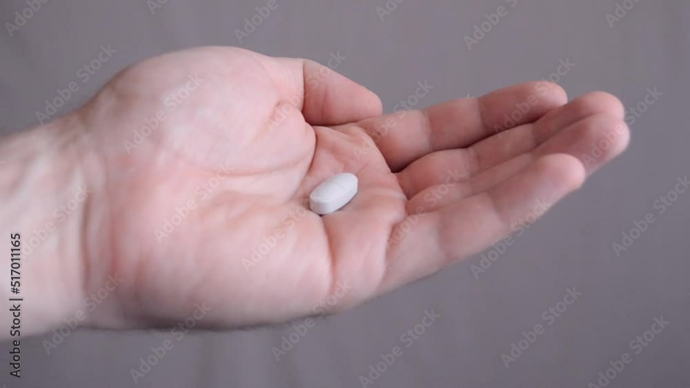 Hand holding pills Close-up. Concept of health care. Vitamins and healthy food Hand holding pills Close-up. Concept of health care. Vitamins and healthy food