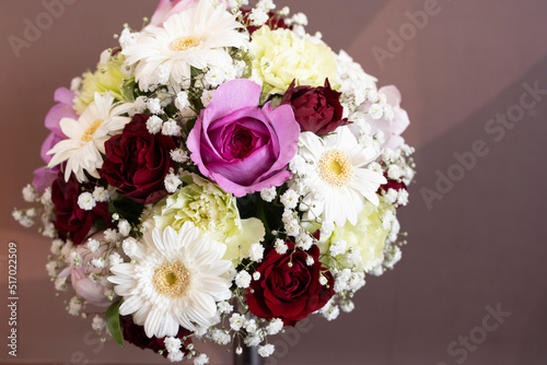 Bouquet of pink and red roses and white gerbera