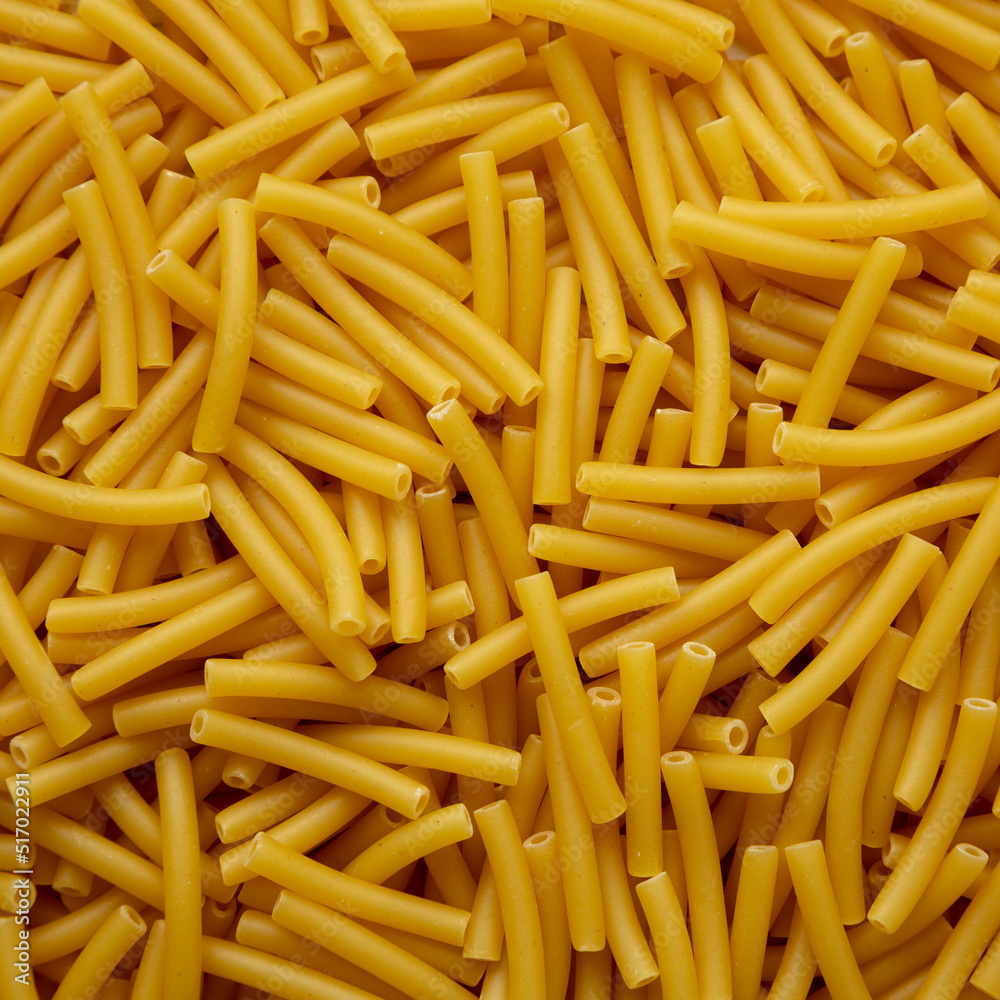 Dry Organic Maccheroni Pasta, top view. Flat lay, overhead, from above. Dry Organic Maccheroni Pasta, top view. Flat lay, overhead, from above.