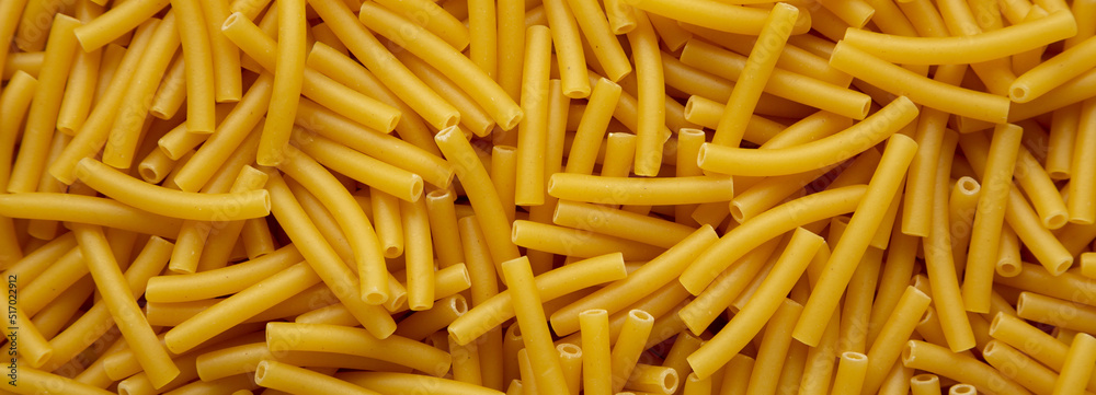 Dry Organic Maccheroni Pasta, top view. Flat lay, overhead, from above. Dry Organic Maccheroni Pasta, top view. Flat lay, overhead, from above.
