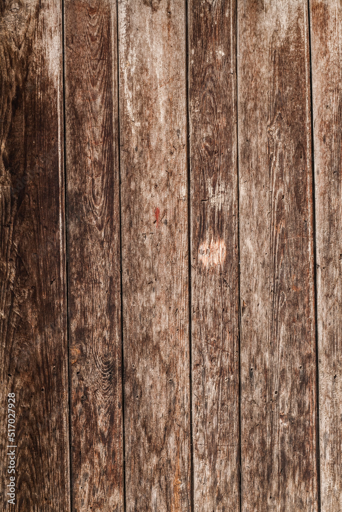 Naklejka premium wooden wall made of longitudinal planks as a vertical background
