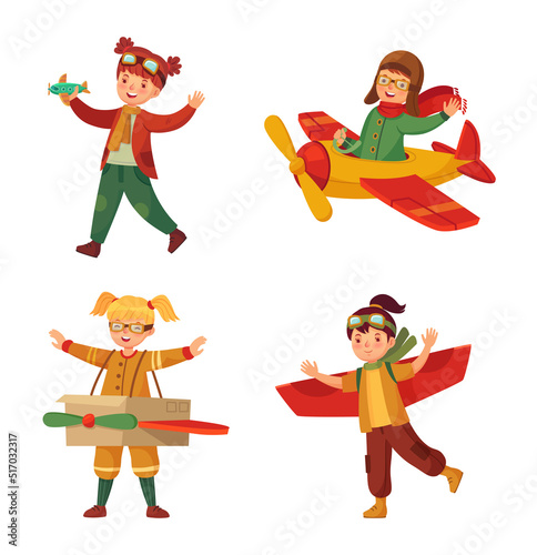 Kids in pilot costumes with toy plane made of card box dreaming of piloting. Little children with paper aircraft wings