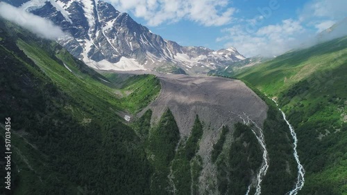 Aerial of Cheget mountain, North Caucasus. Picturesque snow capped peaks of Donguz Orun-Cheget-Karabashi in Elbrus region. Breathtaking summer landscape