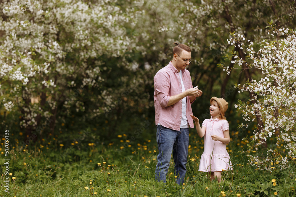 Father and little daughter are walking. Father and little daughter are walking.