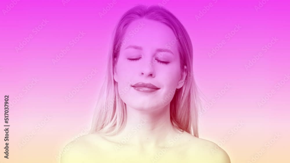 Female headshot posing against pastel background Female headshot posing against pastel background