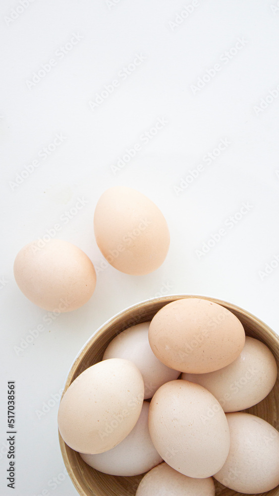 brown chicken eggs on a light plate on a white background brown chicken eggs on a light plate on a white background