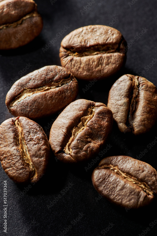 Roasted coffee beans isolated close up on black background, clipping path Roasted coffee beans isolated close up on black background, clipping path