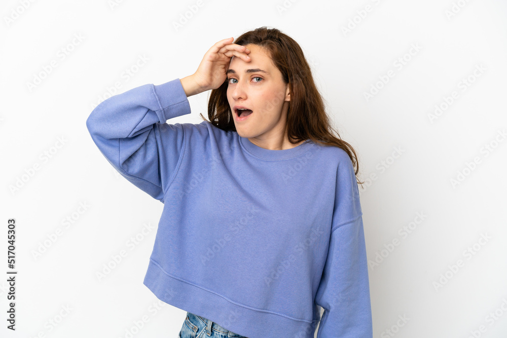 Young caucasian woman isolated on white background doing surprise gesture while looking front Young caucasian woman isolated on white background doing surprise gesture while looking front