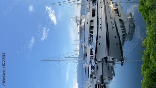 Big boats and yachts in port of Seattle, USA, vertical shot photo