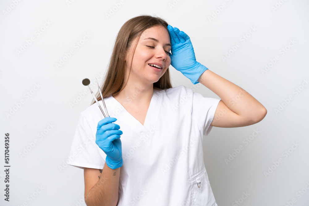 Dentist woman holding tools isolated on white background smiling a lot Dentist woman holding tools isolated on white background smiling a lot