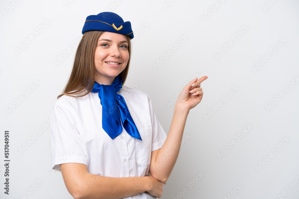 Airplane Lithuanian woman stewardess isolated on white background pointing finger to the side Airplane Lithuanian woman stewardess isolated on white background pointing finger to the side