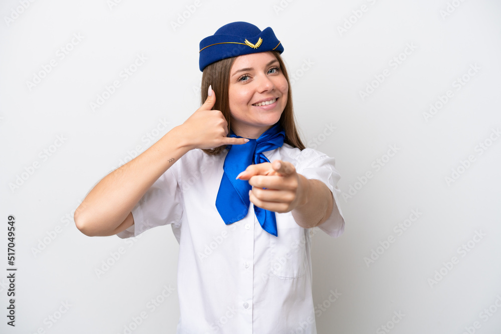 Airplane Lithuanian woman stewardess isolated on white background making phone gesture and pointing front Airplane Lithuanian woman stewardess isolated on white background making phone gesture and pointing front