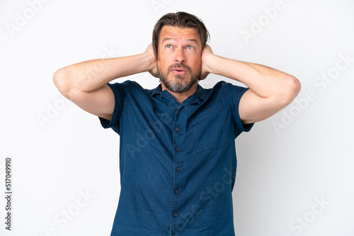 Senior dutch man isolated on white background frustrated and covering ears
