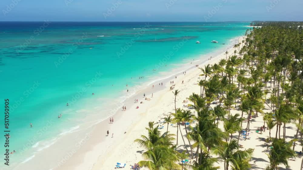 Pristine and bounty shore. Arena Gorda beach with resorts. People faving fun on caribbean coastline. Aerial view from drone