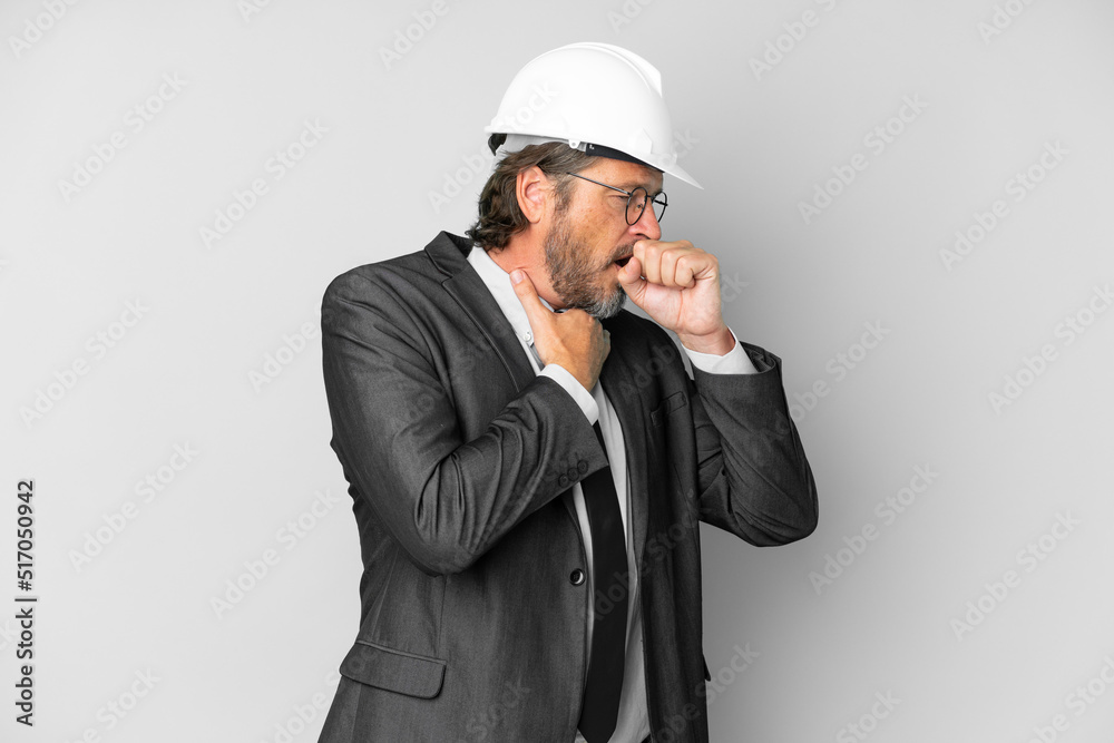 Young architect man with helmet over isolated background is suffering with cough and feeling bad Young architect man with helmet over isolated background is suffering with cough and feeling bad