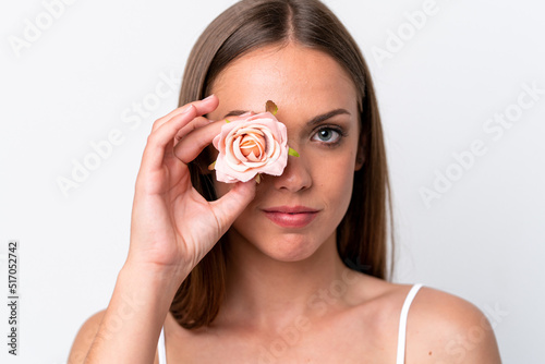 Young caucasian woman isolated on white background holding flowers. Close up portrait