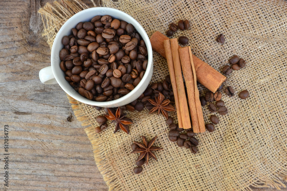 coffee beans and cinnamon sticks coffee beans and cinnamon sticks