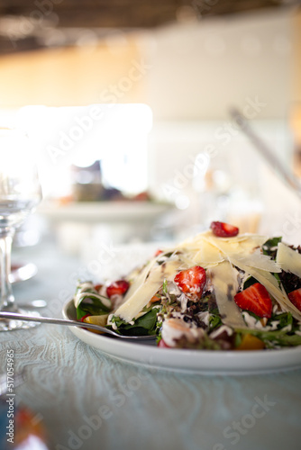 salad with shrimp  strawberries and hard cheese.