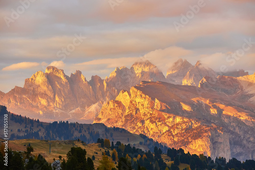 Gorgeous morning scene in Compaccio village and bright larchs. Location place Dolomiti alps, Seiser Alm or Alpe di Siusi, South Tyrol, Italy, Europe.