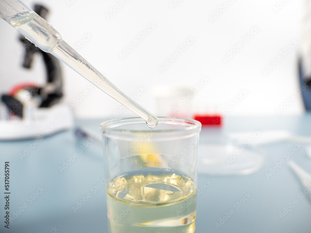 Analytical chemistry - a sample is pipetted into a test tube. Analytical chemistry - a sample is pipetted into a test tube.