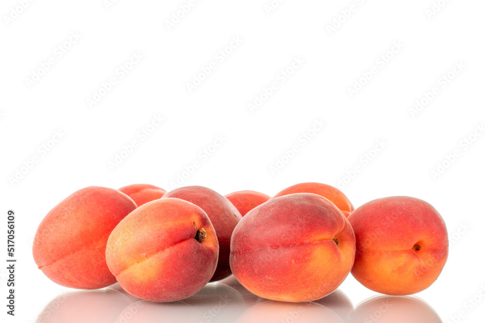Several ripe red apricots, close-up, isolated on a white background. Several ripe red apricots, close-up, isolated on a white background.