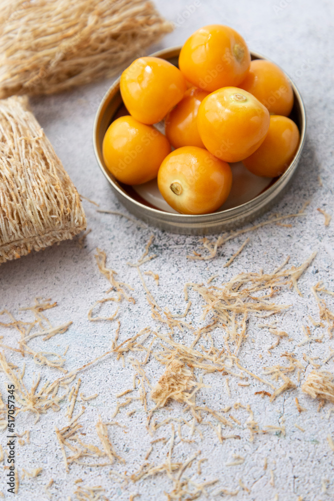 Goldenberries and wheat cereal on a neutral background Goldenberries and wheat cereal on a neutral background