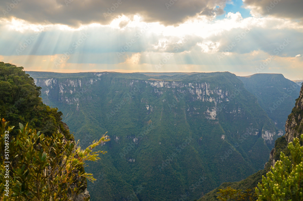 Sunrays break through the clouds over Fortaleza Canyon, in Cambara do Sul, Rio Grande do Sul, Brazil