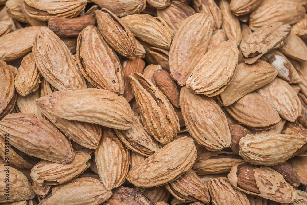 Fototapeta premium Dry almonds in shell close-up