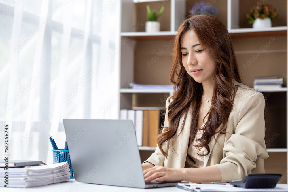 Asian women working in the office, young Asian business women as business executives, founding and running start-up executives, young female business leaders. Startup business concept. Asian women working in the office, young Asian business women as business executives, founding and running start-up executives, young female business leaders. Startup business concept.