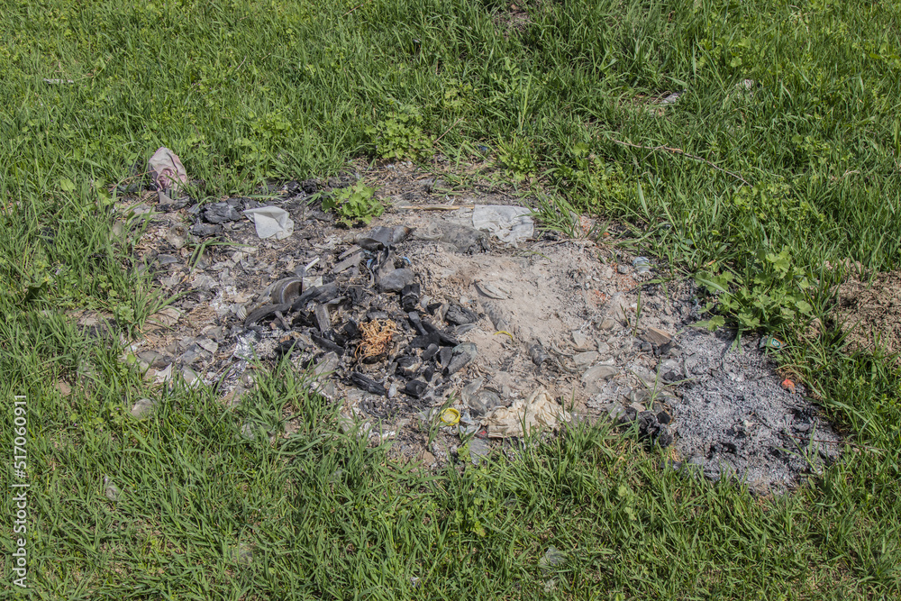 Remains of a campfire after a picnic in nature