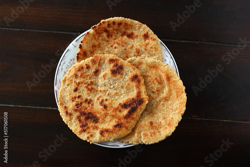 indian gujarati traditional dish food bhakhri or roti  can serve with masala curry photo